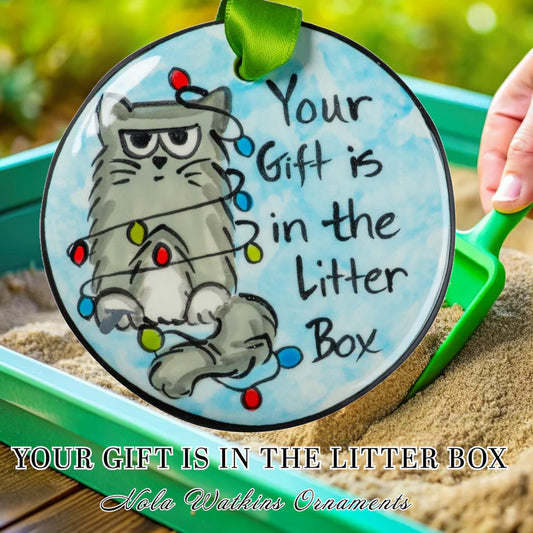 YOUR GIFT IS IN THE LITTER BOX