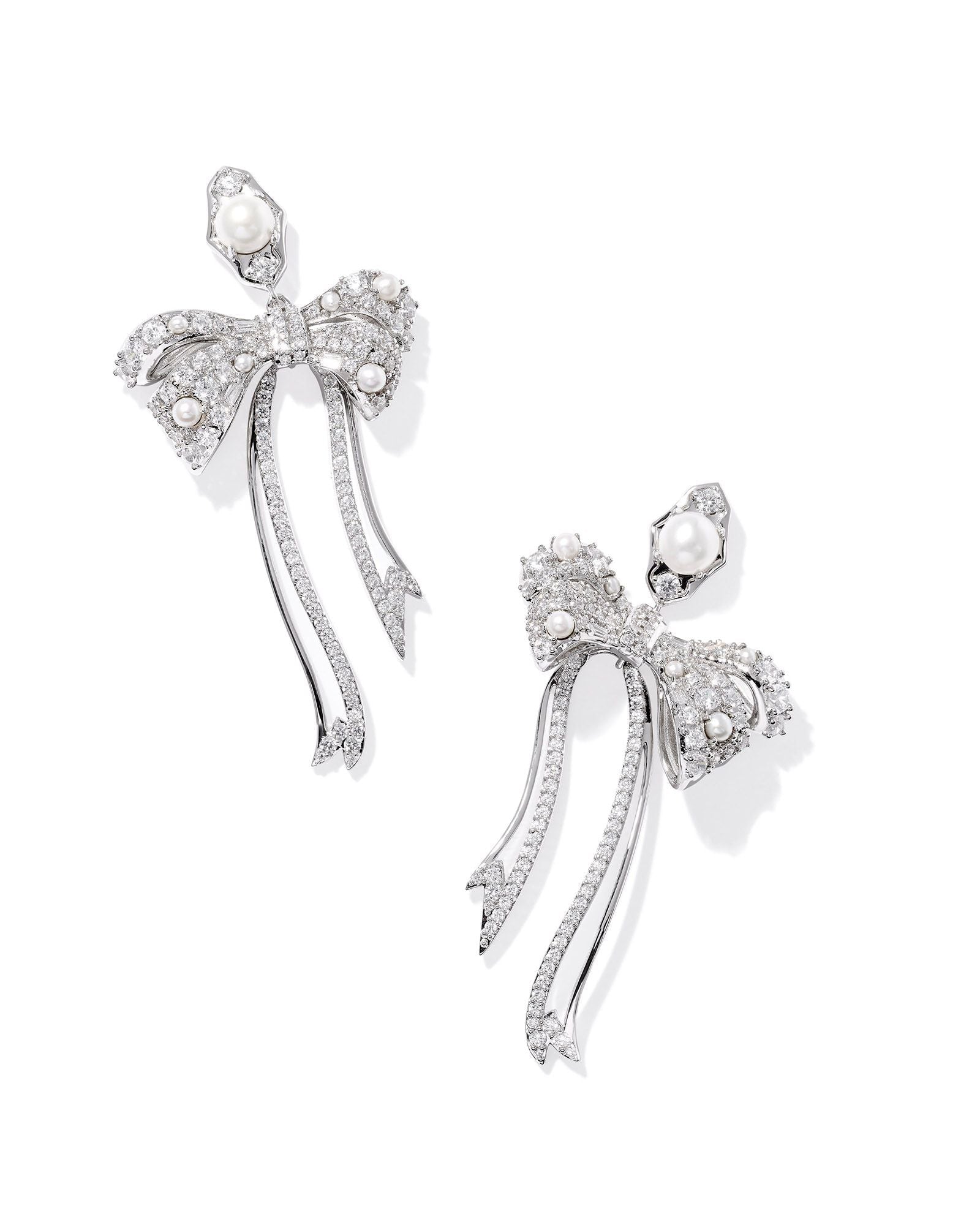 KRISTA BOW STATEMENT EARRINGS SILVER WHITE MIX - She Chester