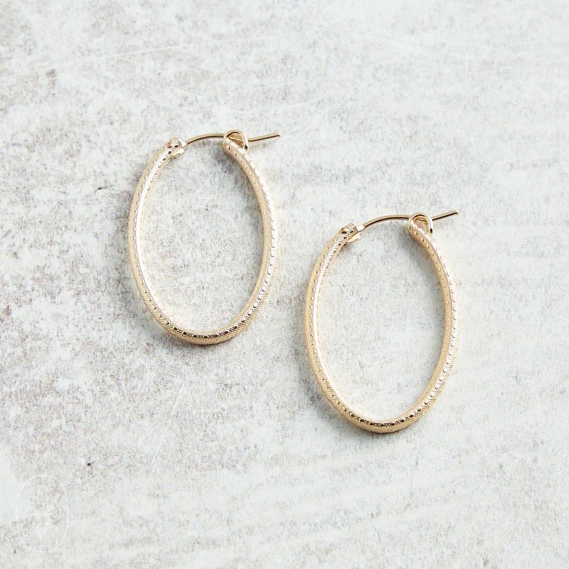 oval gold 1" hoop - textured - She Chester